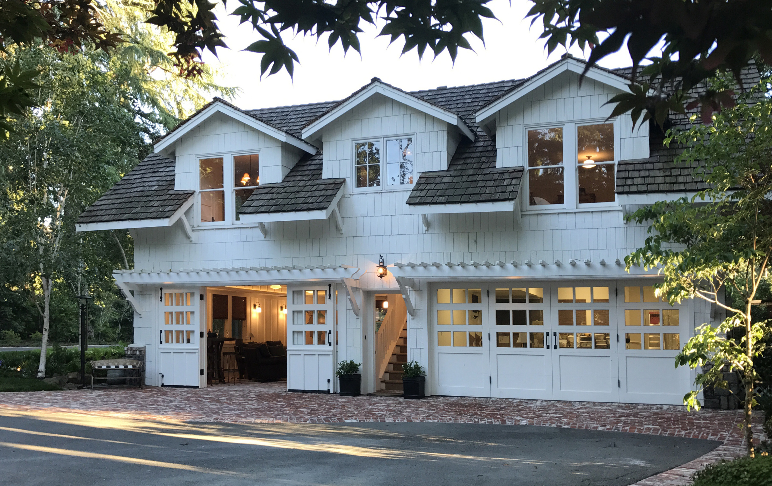 Transitional Farmhouse home entry with indoor/outdoor brick patio