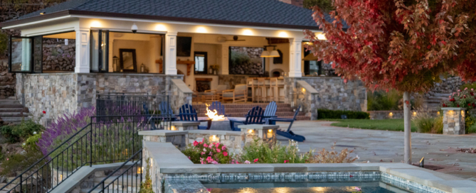 landscape lighting around outdoor kitchen, hot tub and landscaping