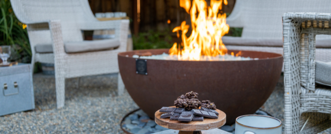 Snacks and hot chocolate laid out beside the fire bowl for an evening treat