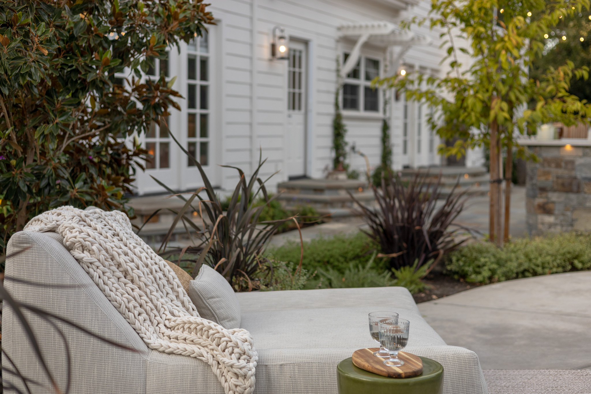 High-tech outdoor living space with louvered pergolas and clean lines