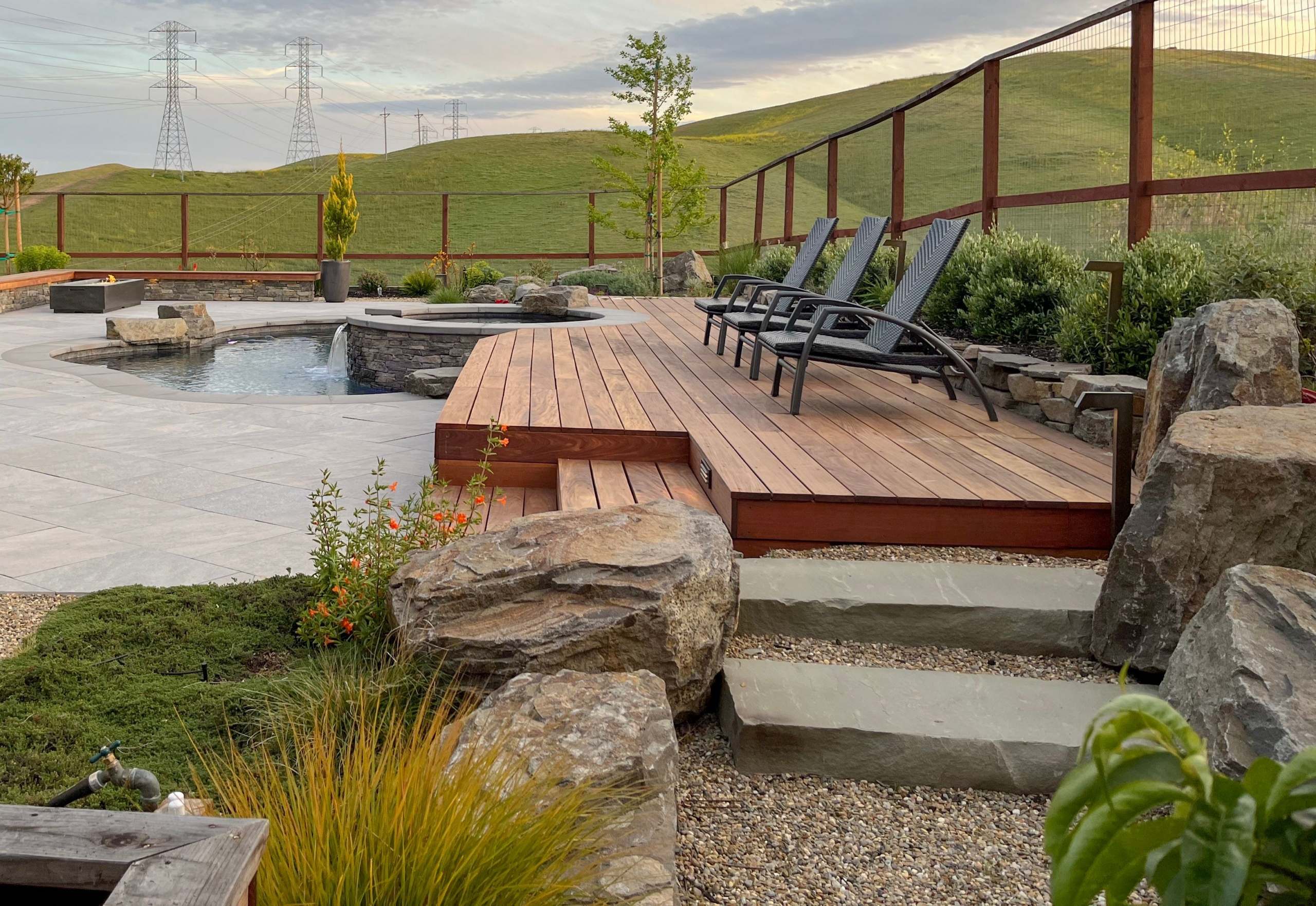 Montgomery Robbins, Inc. luxury residential landscape architecture in the Bay Area, California featuring a custom modern backyard with infinity-edge pool, expansive pool deck, contemporary shade pavilion, and seamless indoor-outdoor integration — high-end outdoor living design for hillside and estate properties in Alamo, Danville, Lafayette, Walnut Creek, Marin, and the Peninsula.